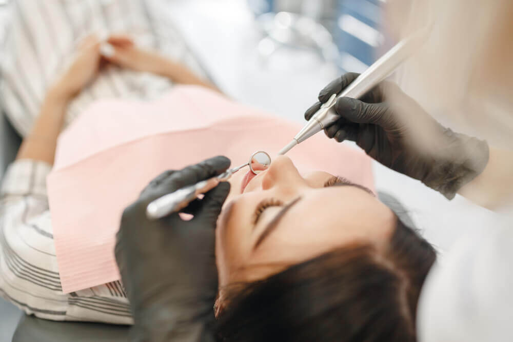 Macquarie Dentists - a woman patient under dental treatment